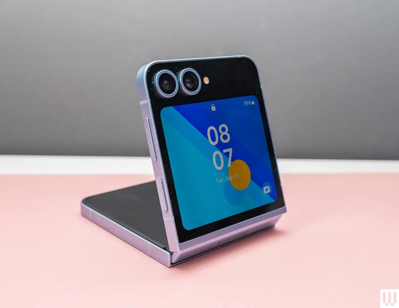 Apple Samsung Samsung Galaxy Z Flip6, A Foldable Phone Showing The Exterior Screen And Cameras (No Border)