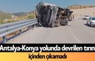Antalya-Konya yolunda devrilen tırın içinden çıkamadı