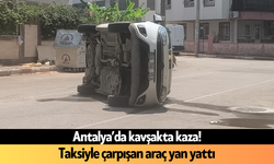 Antalya’da kavşakta kaza! Taksiyle çarpışan araç yan yattı