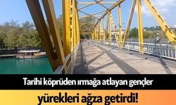 Tarihi köprüden ırmağa atlayan gençler yürekleri ağza getirdi