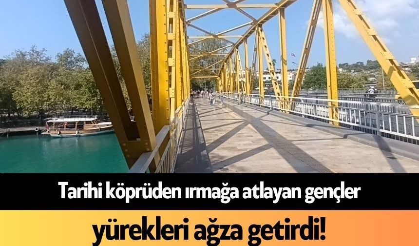 Tarihi köprüden ırmağa atlayan gençler yürekleri ağza getirdi